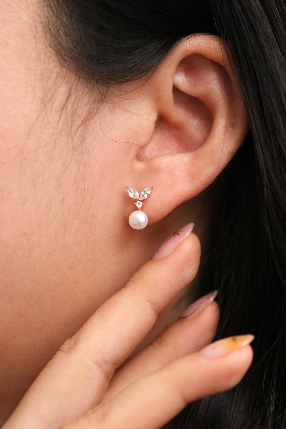 Nabi London cubic leaf pearl drop earrings featuring elegant leaf-shaped design with hanging pearls, stylish jewelry for women.
