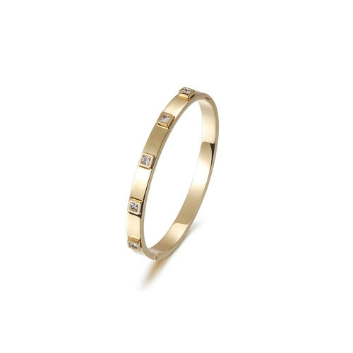 Gold bracelet with embedded diamonds on a white background