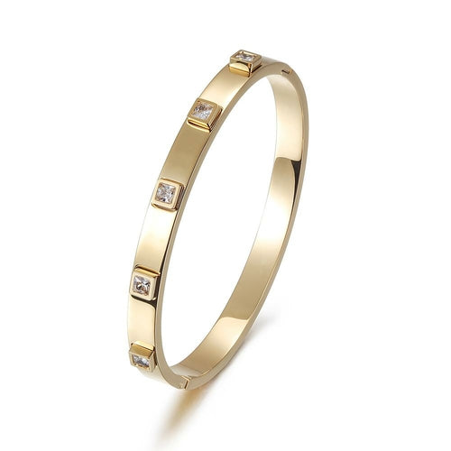 Rose gold bracelet with embedded diamonds on a white background