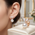 Nabi London cubic leaf pearl drop earrings with elegant design featuring pearl accents and leaf-shaped details.